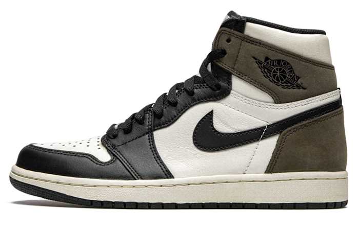 Side view of brown, white, and black Air Jordan sneaker.
